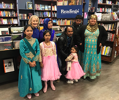 Lyn White with Tara Begum and her family